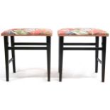 A PAIR OF EARLY 20TH CENTURY EBONISED FRAMED GEORGE V CORONATION STOOLS  with pink floral pattern