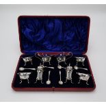 A LATE VICTORIAN CASED EIGHT PIECE SILVER CRUET SET by Samuel Walton Smith, Birmingham 1899,