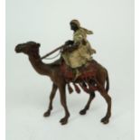 FRANZ BERGMAN (AUSTRIAN 1861-1936) A cold painted bronze figure of an Arab man, sitting on a camel