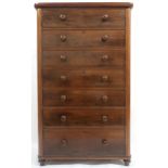 A LARGE VICTORIAN MAHOGANY CHEST OF DRAWERS  with seven long drawers with turned handles on turned