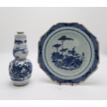 A CHINESE EXPORT BLUE AND WHITE OCTAGONAL PLATE decorated with a landscape scene, the rim with a
