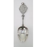 A DUTCH SILVER SPOON with a twisting handle and a cast terminal with decoration of a figure of