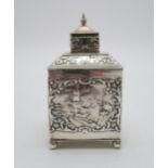 A DUTCH EXPORT SILVER TEA CADDY of cuboid form, the body with repousse and chased decoration of