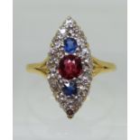 A VICTORIAN MARQUIS SHAPED RING set in bright yellow metal galleried mount, with a central ruby of