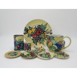 ELIZABETH MARY WATT (SCOTTISH 1886-1954) A collection of fruit painted pottery, including a plate,