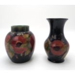 A MOORCROFT POMEGRANATE PATTERN GINGER JAR  13cm high, together with a pomegranate pattern vase,