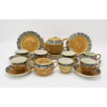 A MARY A RAMSAY FOR STRATHYRE TEASET the mottled brown ground with blue and yellow flowers and