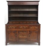 AN 18TH CENTURY OAK WELSH STYLE KITCHEN DRESSER  with corniced top over three open plate shelves