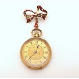 A LADIES FOB WATCH the open face fob watch is 18ct gold, with gold coloured floral engraved dial,
