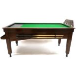 AN EARLY 20TH CENTURY OAK COIN OPERATED BAR BILLIARDS TABLE  with hinged integrated scoreboard