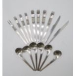 ARNE JACOBSEN FOR ANTON MICHELSEN; a part-suite of model 660 stainless steel cutlery, comprising two