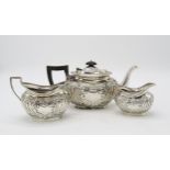 A LATE VICTORIAN BACHELORS SILVER TEA SERVICE by Jenkins & Timm, Sheffield 1898, of oval form,