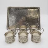 A PERSIAN SILVER TRAY of rectangular form, finely engraved with scrolling foliate decoration, with