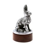 A CHROME ALVIS CAR MASCOT Second quarter 20th century, modelled as a hare and set upon a wooden
