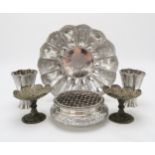 A PERSIAN SILVER FOOTED DISH of lobed form, the well decorated with a central floral medallion,