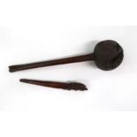 A POLYNESIAN CLUB  The globe shaped knop on carved handle, 38cm long and a carved pointer with