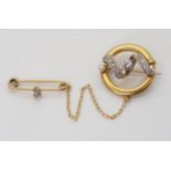 A CHAIN LINKED DOUBLE BROOCH set with old cut diamonds and a pearl, set throughout in yellow and