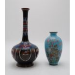 A JAPANESE CLOISONNE BALUSTER VASE  decorated with two birds above garden flowers on a powder blue