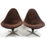 A PAIR OF MID 20TH CENTURY LURASHELL SWIVEL LOUNGE CHAIRS  with brown fabric removable cover over