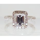 A 14K WHITE GOLD SUBSTANTIAL DIAMOND RING set with an estimated approx 1.40ct step cut diamond, with
