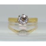 AN OLD CUT DIAMOND SOLITAIRE the 18ct yellow and white gold mount with classic crown setting,