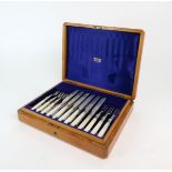 A CASED SET OF EDWARDIAN SILVER & MOTHER OF PEARL FISH KNIVES & FORKS by William Hutton & Sons,