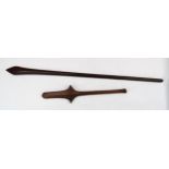 A POLYNESIAN WAR CLUB The serrated blade joined to a vertical bar and tapering shaft, 78cm long