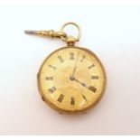 AN OPEN FACE POCKET WATCH in 18ct gold bearing London hallmarks for 1859. the gold coloured dial