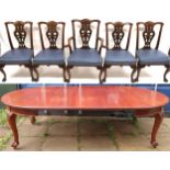 A VICTORIAN MAHOGANY CIRCULAR WIND OUT EXTENDING DINING TABLE  with three additional leaves, 137cm x