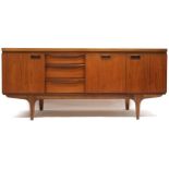 A MID 20TH CENTURY TEAK GREAVES AND THOMAS SIDEBOARD  with three graduating drawers alongside fall