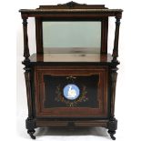 A VICTORIAN BURR WALNUT VENEERED EBONISED MUSIC CABINET  with shaped top with brass mounted edges