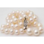 PEARLS WITH A MARQUIS DIAMOND CLASP the pearls with a good lustre taper in size from 9mm to 6.6mm,