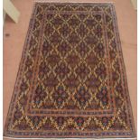A DARK BLUE GROUND MOOD RUG  with all-over medallion design and multiple coloured borders, 302cm