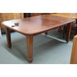 A Victorian mahogany wind out extending dining table on square tapering supports terminating in