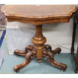 A Victorian burr walnut and satinwood inlaid serpentine front fold-over tea table on turned baluster