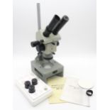 A Russian model MBC-10 stereoscopic microscope, with additional lenses and instruction booklets;