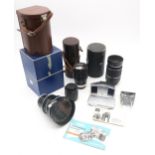 A Voigtlander Zoomar 1:2.8 36mm-82mm camera lens, retaining its original leather case, packaging and