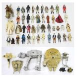 A selection of vintage Star Wars toys, to include a Kenner 1979 Millennium Falcon, 80s-era AT-AT and