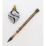 A yellow metal telescopic pen, engraved with foliate detail and the name "T. Matthew", together with