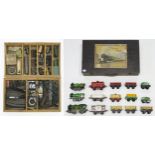 Assorted Hornby 0-gauge clockwork locomotives and stock, contained in a wooden case with label to
