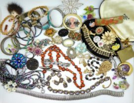A collection of vintage costume jewellery to include peacock beads, necklaces, brooches and