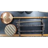 A lot comprising a carved oak wall mounted plate rack, copper and brass bedwarmer, bamboo swagger