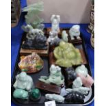 A collection of Chinese hardstone figures, including dragons, phoenixes, lions, buddhas etc