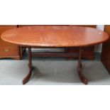 A mid 20th century G Plan oval extending dining table with internal leaf on shaped base, 72cm high x