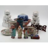 A collection of Asian ceramics including a pair of 20th century blanc de chine Foo dogs, a Famille