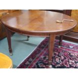 A Victorian mahogany oval wind out extending dining table on square tapering supports, 75cm high x