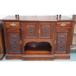 An early 20th century mahogany breakfront sideboard with pair of central cabinet doors flanked by