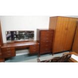 A mid 20th century teak Lebus three piece bedroom suite comprising mirror back dressing table, 118cm