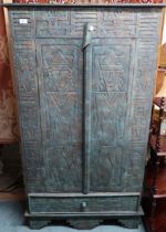 A 20th century faux stone Aztec style two door cabinet, 150cm high x 85cm wide x 29cm deep Condition
