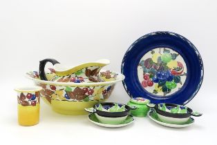 Richard Amour for Bough pottery, a leaf and berry painted washbowl, ewer and tooth mug, a fruit